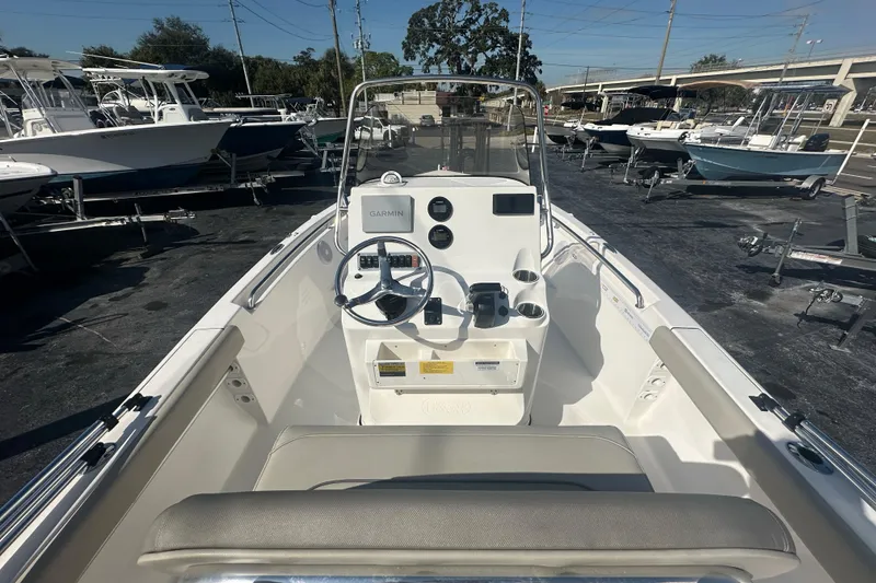 Slide: The Image of 2024 Key West 189 FS boat interior with steering console and Garmin navigation system. - 19