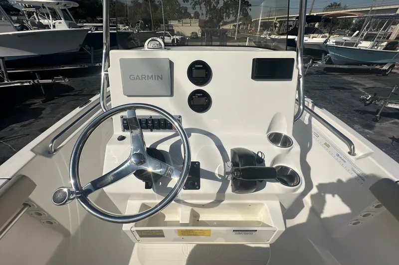 Slide: The Image of 2024 Key West 189 FS boat console with Garmin navigation system and steering wheel. - 20
