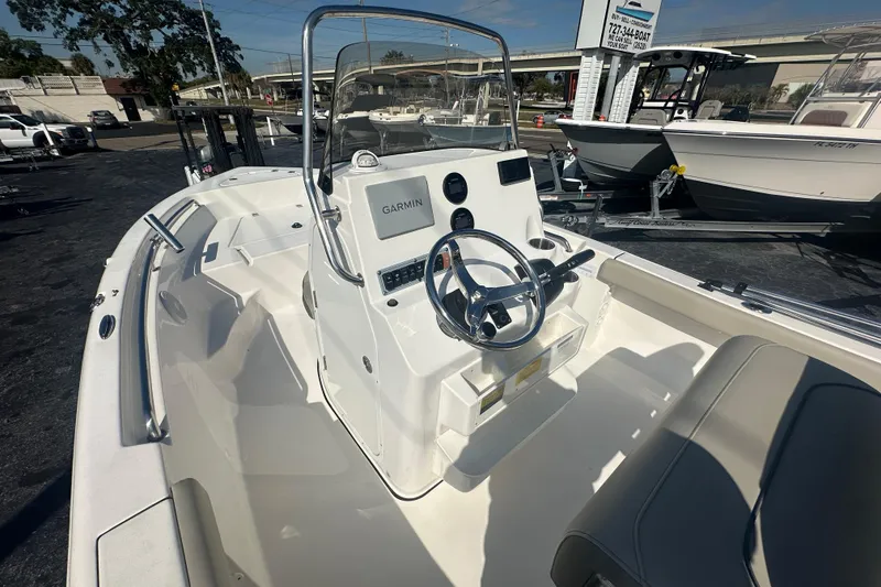 Slide: The Image of 2024 Key West 189 FS boat interior with Garmin navigation system and steering wheel. - 21