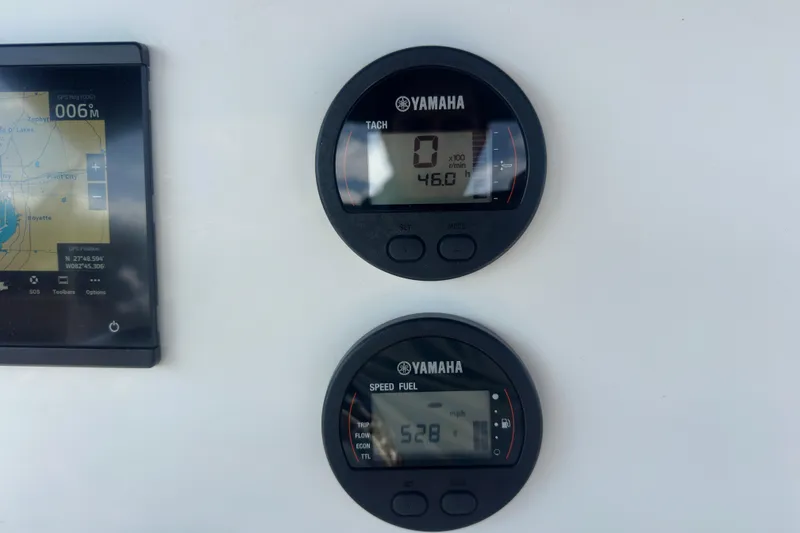 Slide: The Image of Yamaha gauges and GPS display on 2024 Key West 189 FS boat dashboard. - 27