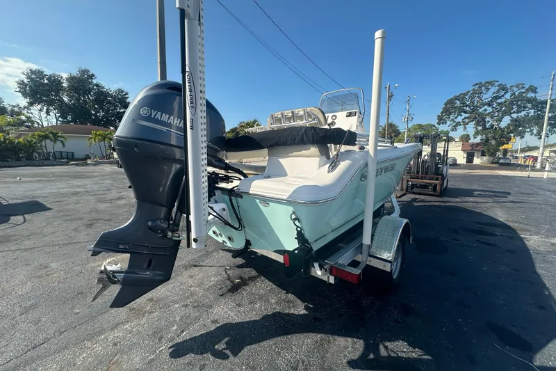 Slide: The Image of 2024 Key West 189 FS boat with Yamaha engine on trailer, parked outdoors. - 5