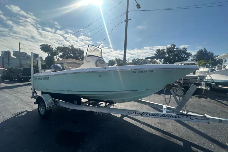 Slide: The Image of 2024 Key West 189 FS boat on trailer under sunny sky. - 7