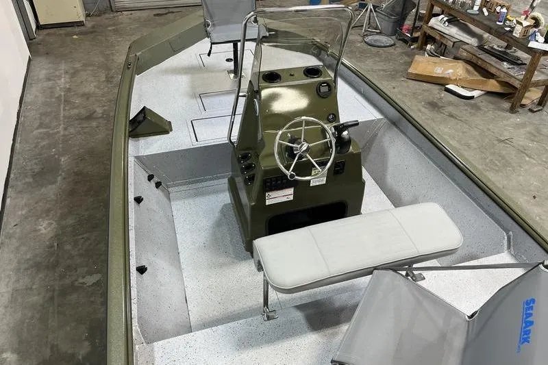 Slide: The Image of 2025 SeaArk Shadow 187J boat interior with steering console and seating. - 4