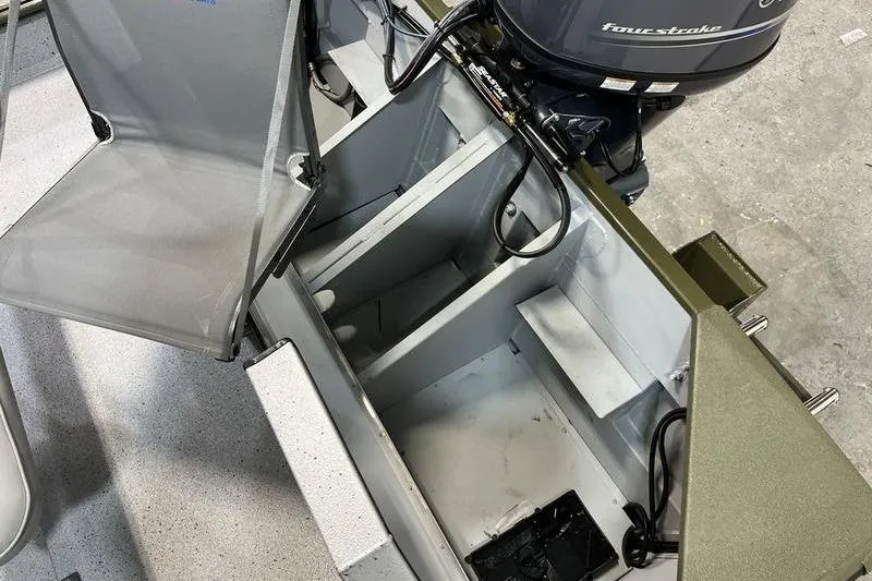 Slide: The Image of 2025 SeaArk Shadow 187J boat interior with motor and seating. - 6