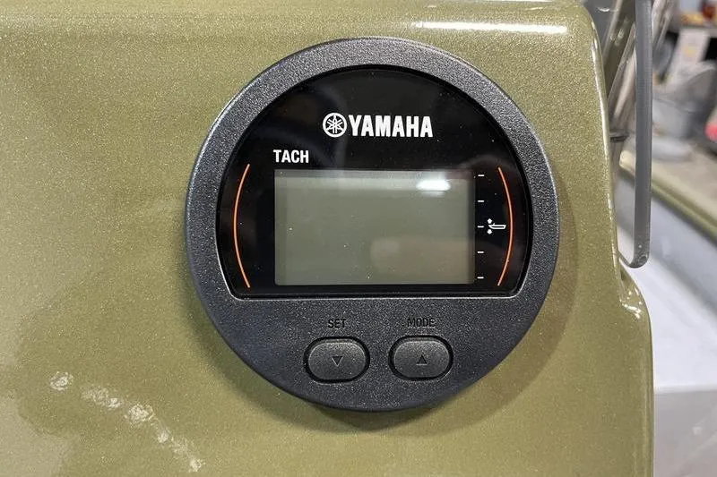 Slide: The Image of Yamaha tachometer on 2025 SeaArk Shadow 187J boat dashboard. - 8