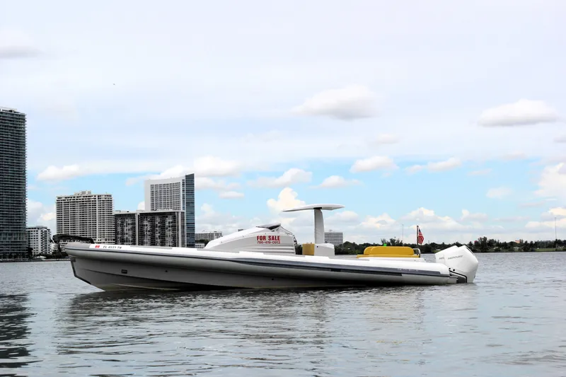 Slide: The Image of 2013 Zeta Elle 34 Custom boat on water with city skyline background. - 11