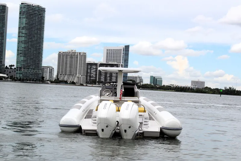 Slide: The Image of Zeta Elle 34 Custom 2013 boat on water with city skyline background. - 3