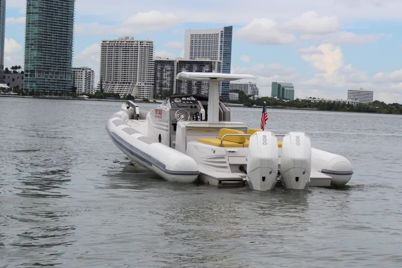 Slide: The Image of Zeta Elle 34 Custom 2013 boat on water with city skyline background. - 4