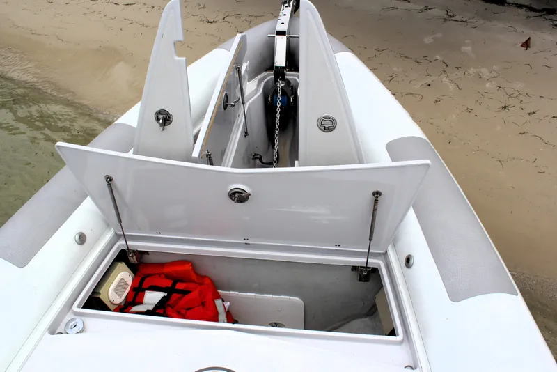 Slide: The Image of Zeta Elle 34 Custom 2013 boat storage compartments with life jacket and equipment. - 5