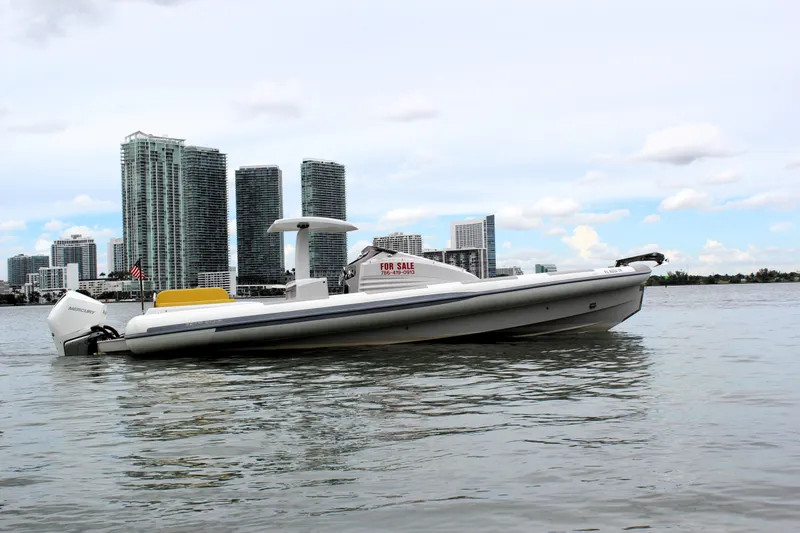 Slide: The Image of Zeta Elle 34 Custom 2013 boat for sale on water with city skyline background. - 6
