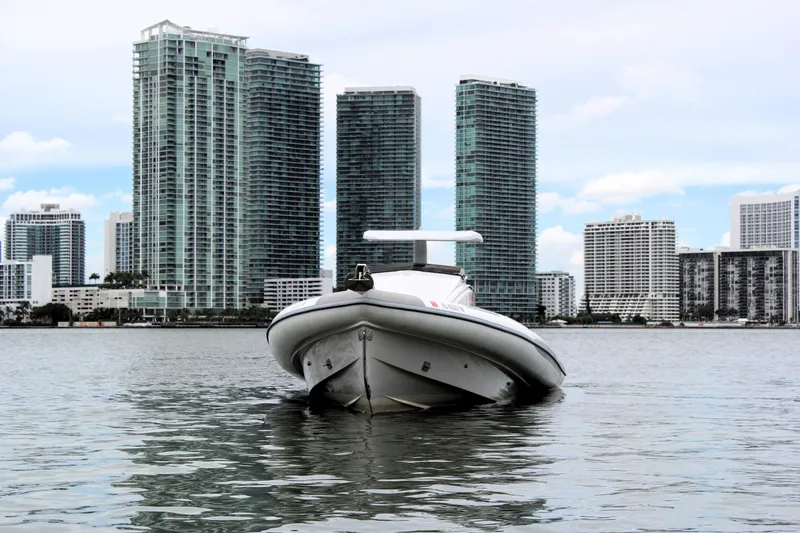 Slide: The Image of Zeta Elle 34 Custom 2013 boat on water with city skyline background. - 8