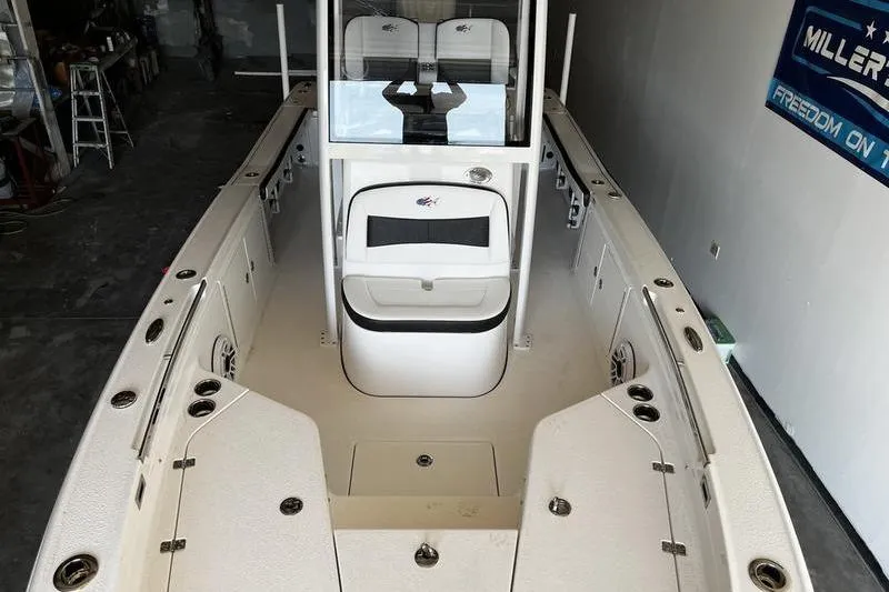 Slide: The Image of 2025 Crevalle 26 HCO boat interior with seating and storage compartments. - 11