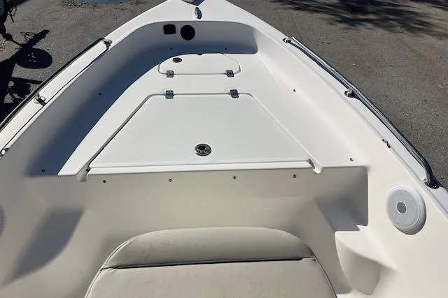 Slide: The Image of 2023 Key West 1720 Center Console boat interior with storage compartments and seating. - 10
