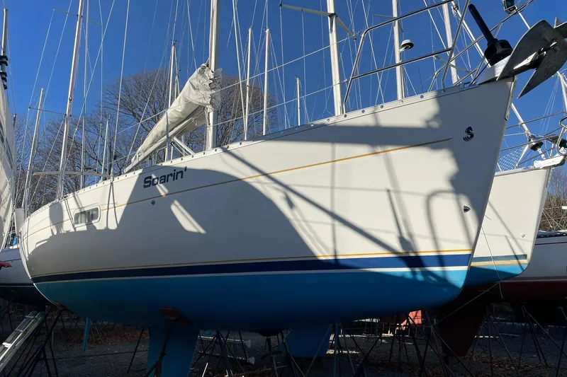 Slide: The Image of 2001 Beneteau Oceanis 361 sailboat docked at marina under clear blue sky. - 1