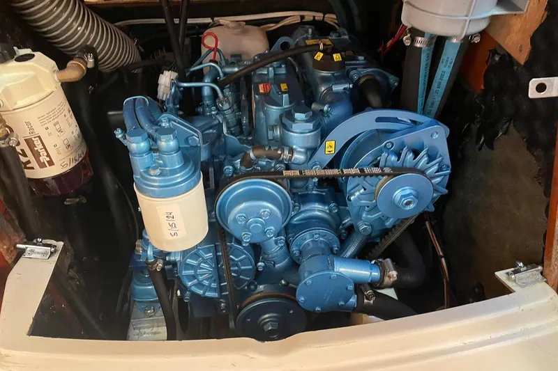 Slide: The Image of Interior of 2001 Beneteau Oceanis 361 with striped cushions and nautical decor. - 22