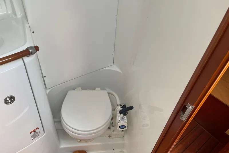 Slide: The Image of Interior view of 2001 Beneteau Oceanis 361 sailboat, featuring a compact kitchen area. - 27