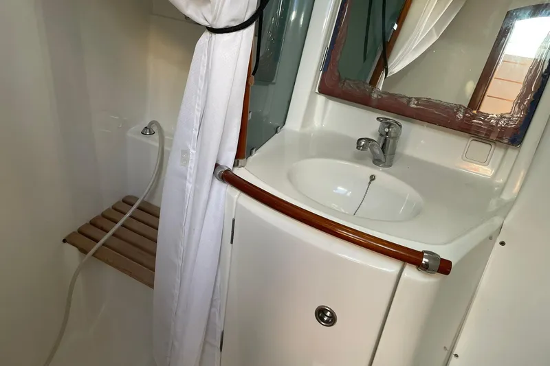 Slide: The Image of Beneteau Oceanis 361 yacht kitchen with open fridge and storage, 2001 model. - 30