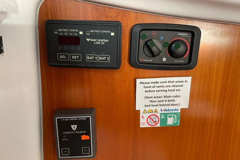 Slide: The Image of Control panel on a 2001 Beneteau Oceanis 361 yacht, featuring battery and gas systems. - 35