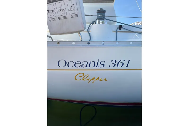 Slide: The Image of 2001 Beneteau Oceanis 361 Clipper sailboat, side view with name and model visible. - 41