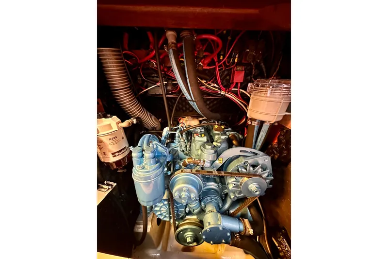 Slide: The Image of Engine compartment of 2001 Beneteau Oceanis 361 sailboat, showcasing detailed mechanical components. - 61
