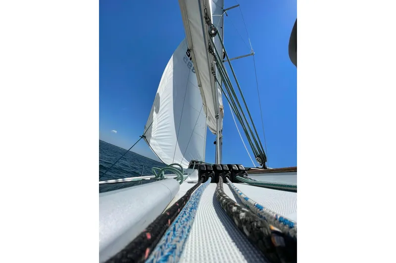 Slide: The Image of Sailing on a 2001 Beneteau Oceanis 361, vibrant blue sky, and open sea. - 66