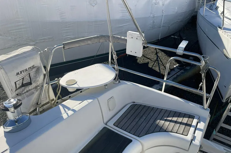 Slide: The Image of Beneteau Oceanis 361 sailboat, 2001 model, docked among other boats. - 9
