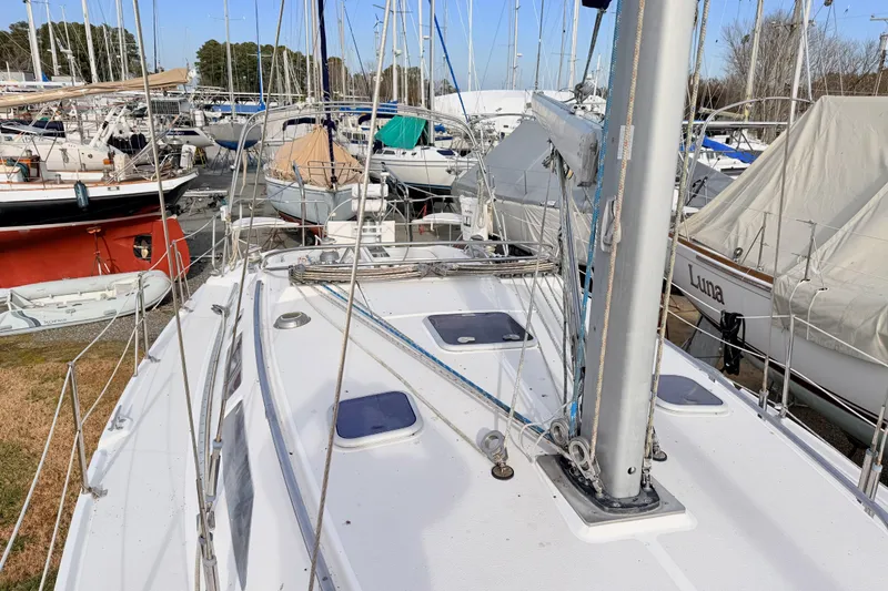 Slide: The Image of Catalina 380 sailboat from 2001 in a marina with other boats. - 11