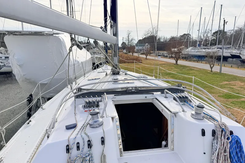 Slide: The Image of 2001 Catalina 380 sailboat deck view with rigging and open hatch. - 15