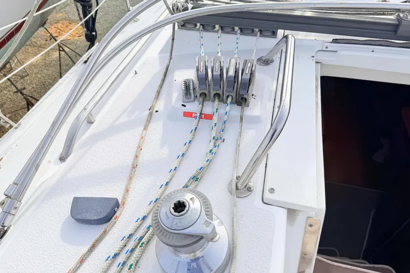 Slide: The Image of Deck of 2001 Catalina 380 sailboat with winch and rope clutches. - 16