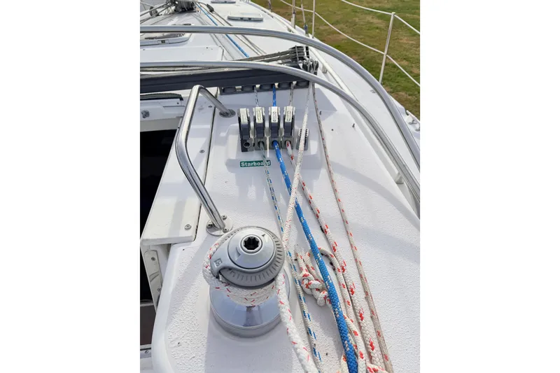 Slide: The Image of Deck of 2001 Catalina 380 sailboat with winch and ropes. - 17