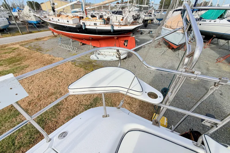 Slide: The Image of Catalina 380 sailboat, 2001 model, in a boatyard with other vessels. - 18