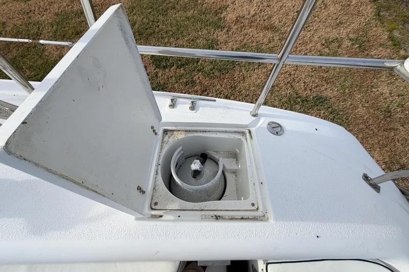 Slide: The Image of Open anchor locker on 2001 Catalina 380 sailboat, showing anchor storage. - 19
