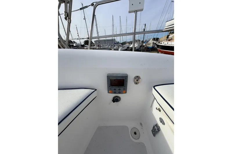 Slide: The Image of Cockpit view of 2001 Catalina 380 sailboat with navigation equipment in marina. - 20