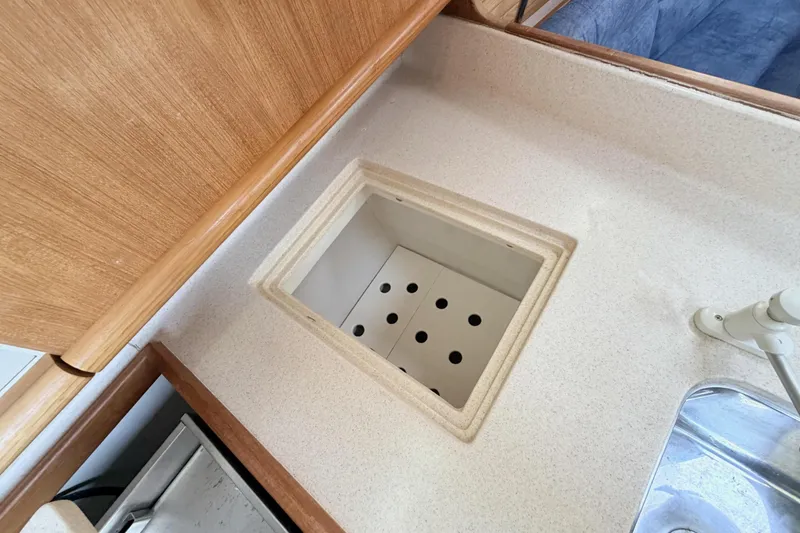 Slide: The Image of Interior of 2001 Catalina 380 yacht showing kitchen sink and countertop details. - 25