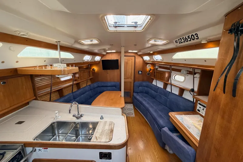 Slide: The Image of Interior of 2001 Catalina 380 sailboat with spacious seating and modern amenities. - 27