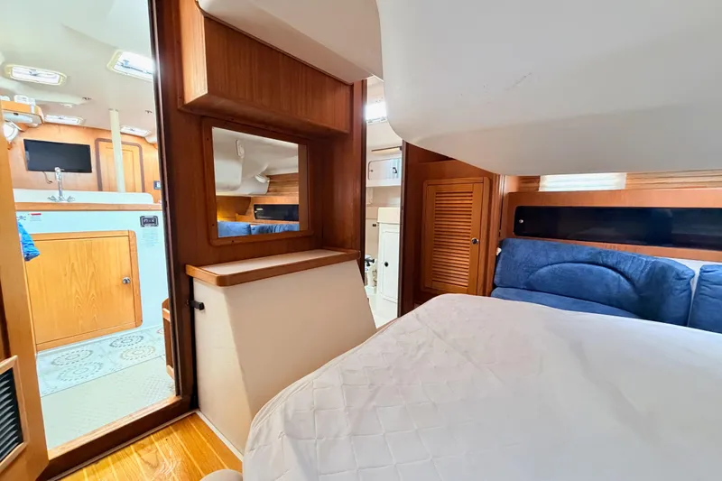 Slide: The Image of Interior of 2001 Catalina 380 yacht with cozy cabin and wooden finishes. - 32