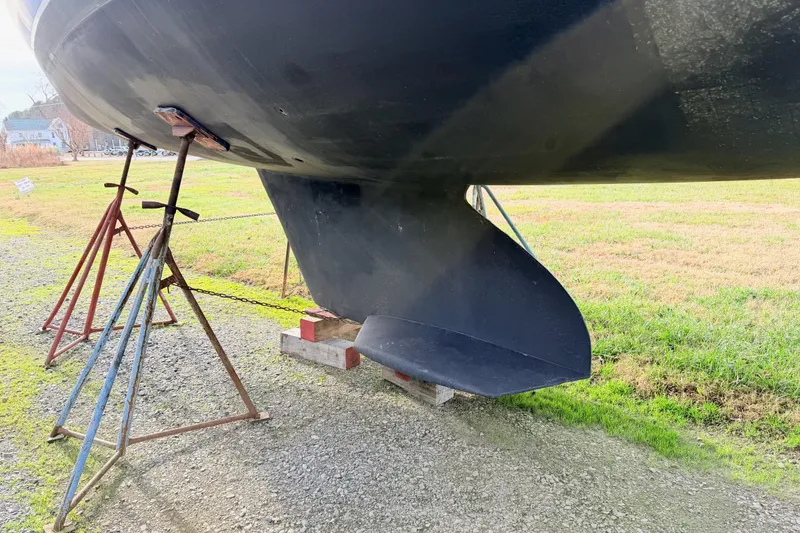 Slide: The Image of Catalina 380 sailboat keel on stands, 2001 model, displayed outdoors. - 5
