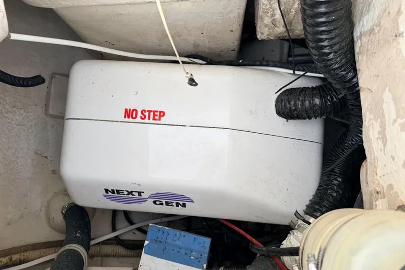Slide: The Image of Engine compartment of a 2001 Catalina 380 sailboat with "No Step" warning. - 50