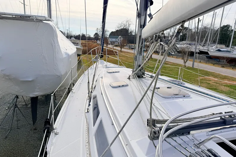 Slide: The Image of Catalina 380 sailboat from 2001 docked, showcasing deck and rigging details. - 8