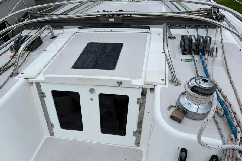Slide: The Image of Cockpit of a 2001 Catalina 380 sailboat with winch and ropes. - 9