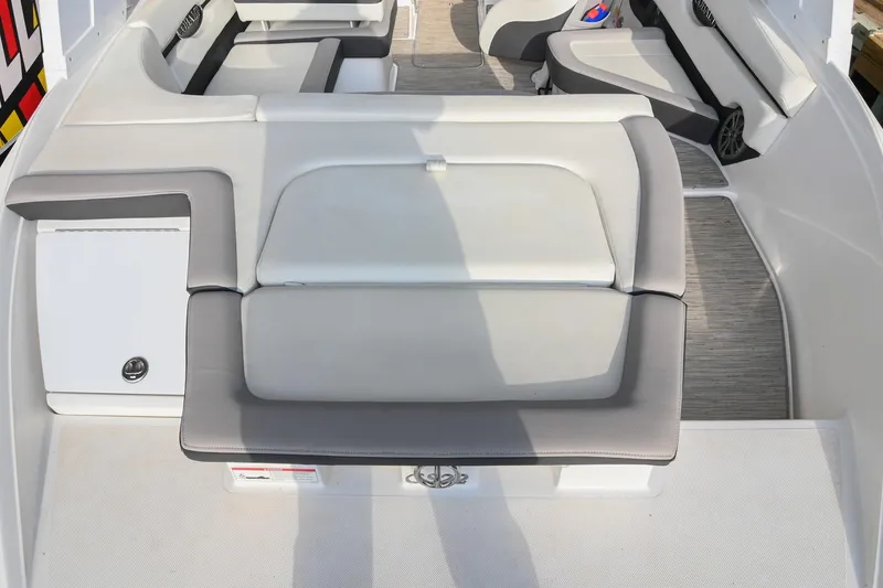 Slide: The Image of 2023 Cobalt CS22 boat interior with cushioned seating and storage compartments. - 14