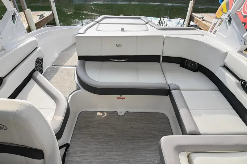 Slide: The Image of 2023 Cobalt CS22 boat interior with white seating and modern design. - 18