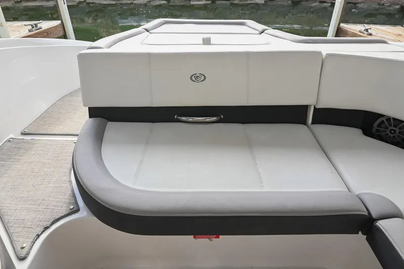 Slide: The Image of 2023 Cobalt CS22 boat interior with cushioned seating and sleek design. - 20