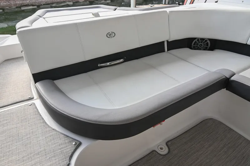 Slide: The Image of 2023 Cobalt CS22 boat interior with cushioned seating and speaker detail. - 21