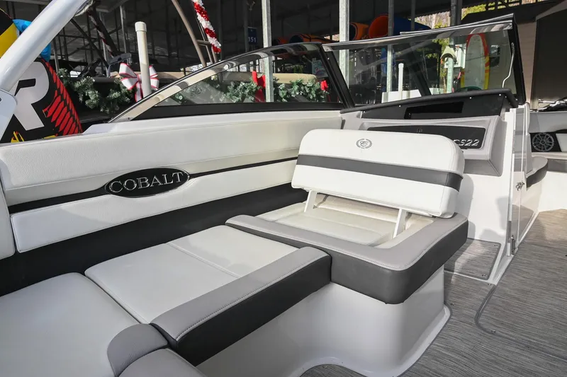 Slide: The Image of 2023 Cobalt CS22 boat interior with white and gray seating, showcasing luxury design. - 22