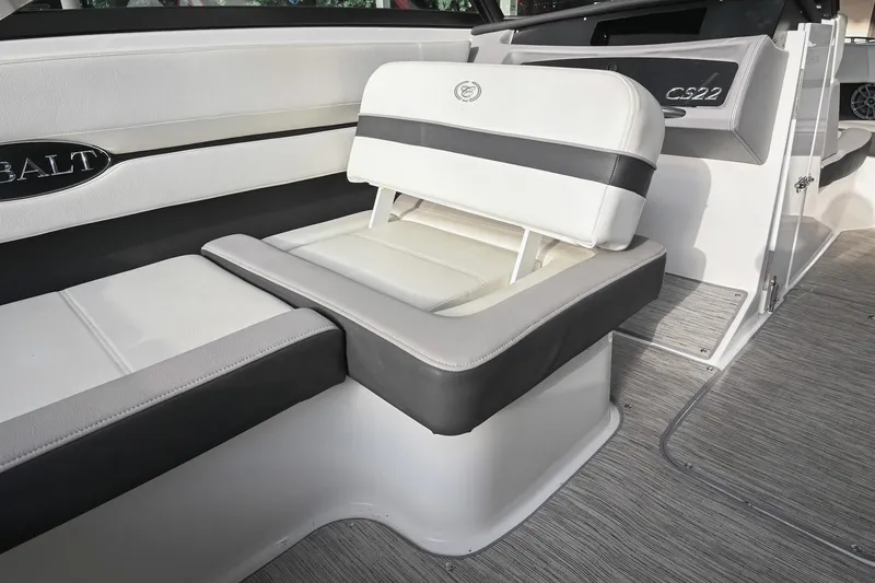 Slide: The Image of 2023 Cobalt CS22 boat interior with white and gray seating, showcasing luxury design. - 24