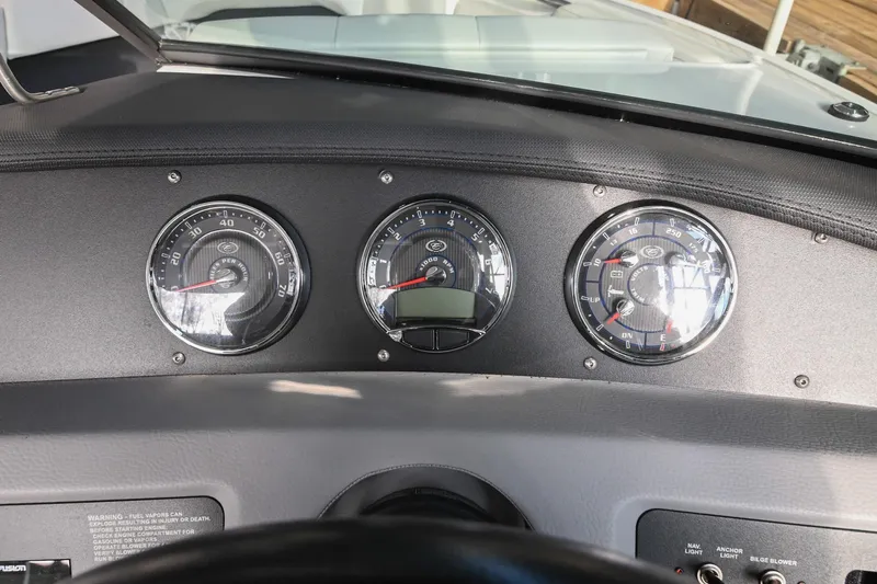 Slide: The Image of Dashboard of 2023 Cobalt CS22 boat with three analog gauges. - 32
