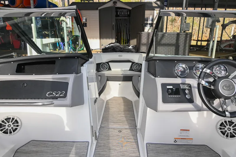 Slide: The Image of 2023 Cobalt CS22 boat interior with modern dashboard and seating. - 36