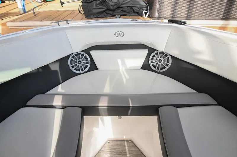 Slide: The Image of Interior of 2023 Cobalt CS22 boat with cushioned seating and speakers. - 43