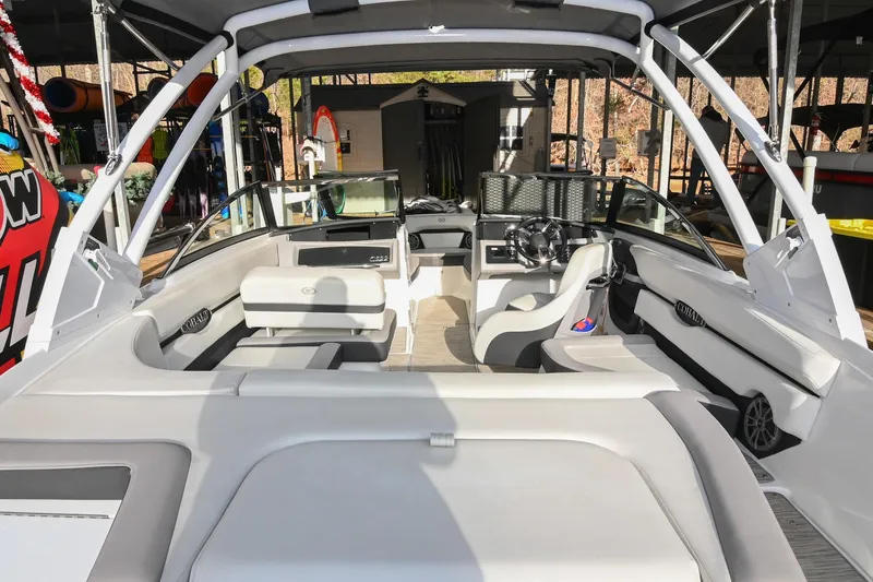 Slide: The Image of 2023 Cobalt CS22 boat interior with modern seating and steering wheel. - 9